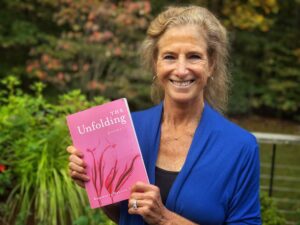 Tara Brach holding Rosemerry Wahtola Trummer's new book, The Unfolding